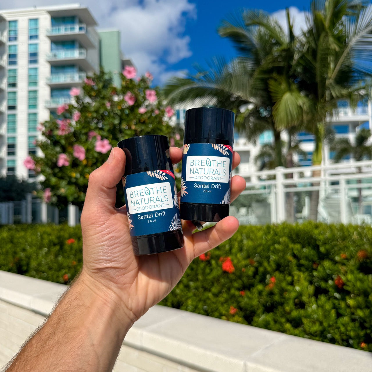 Breathe Naturals natural deodorant solution for people who get rashes from baking soda deodorants shown santal drift on a tropical florida background