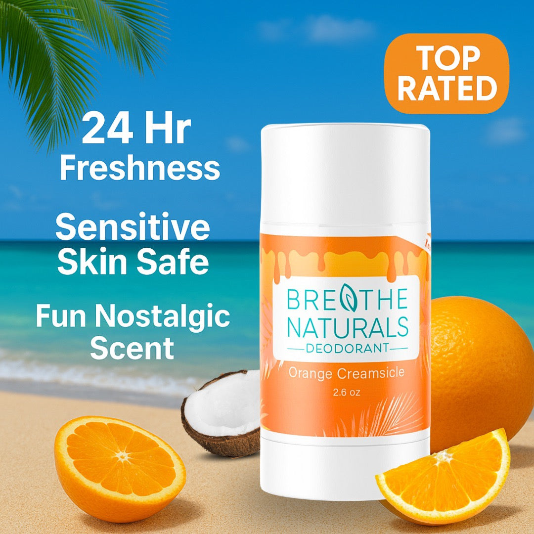 Deodorant stick with orange creamsicle flavor on a beach background, featuring 'Breathe Naturals' brand.